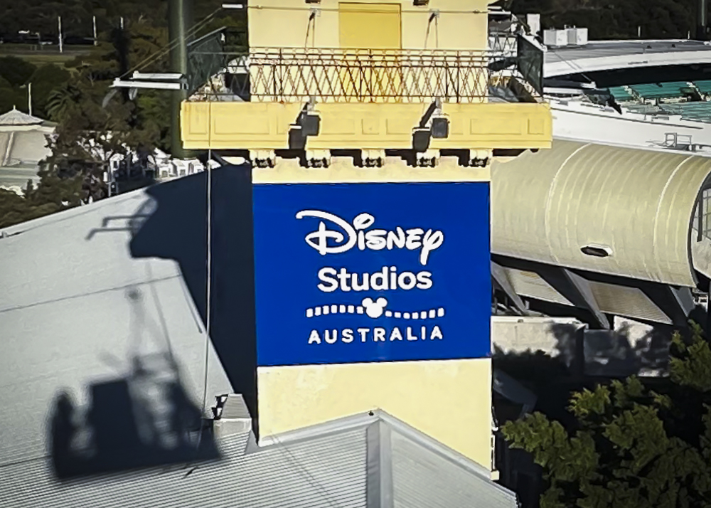 Disney Studios Australia signage install on yellow clocktower