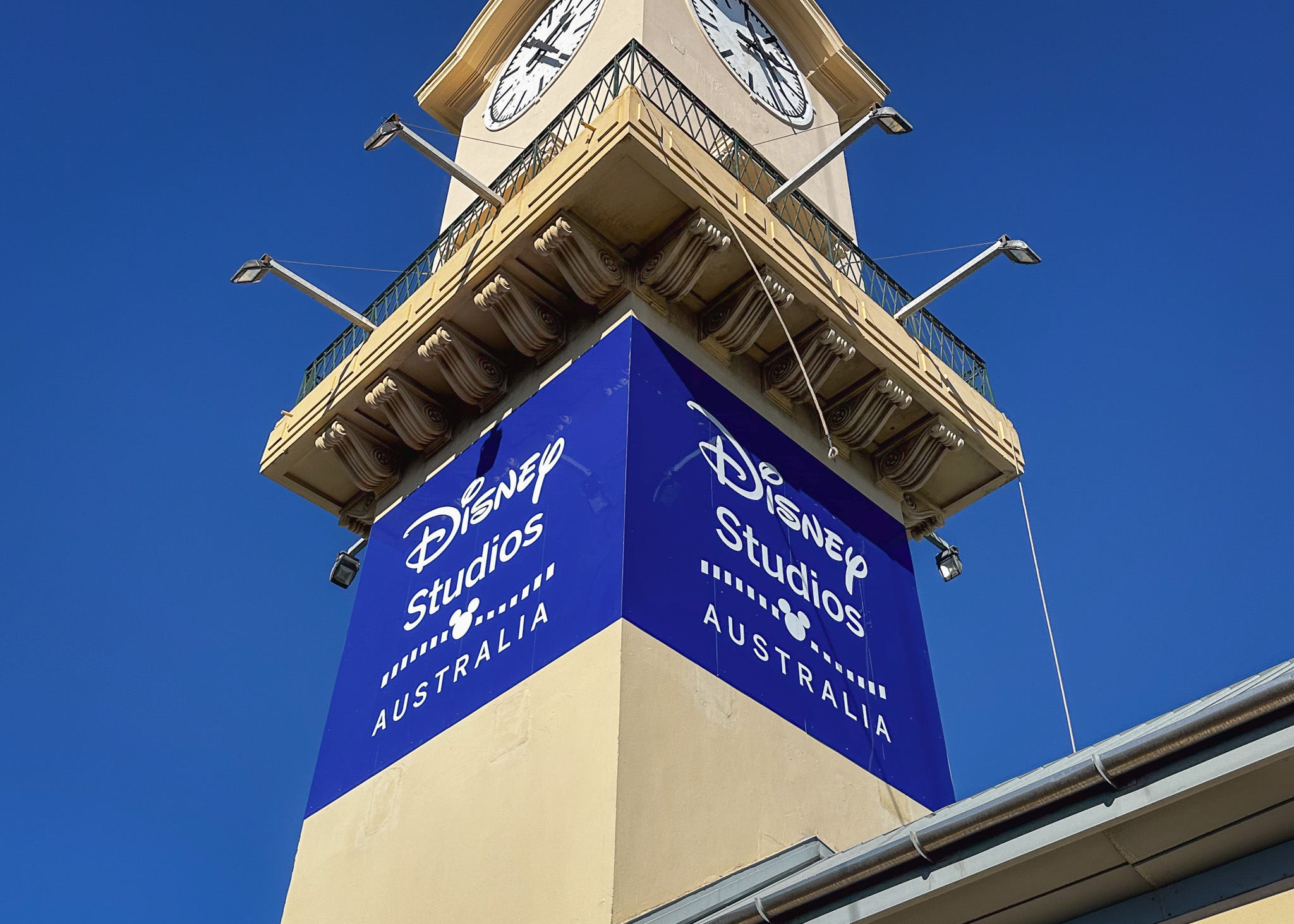 Disney Studios signage on yellow clocktower